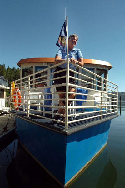 
Yvonne Cornell stands on the Idaho, the tour boat owned by Heyburn State Park. The boat will host a themed cruise where Robert Singletary will speak about the history of steamboats that once plied the waters of Lake Coeur d'Alene. Cornell coordinates the cruises for the park and acts as first mate. 
 (Jesse Tinsley / The Spokesman-Review)