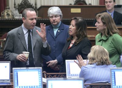 State Senate President Pro Tem Darrell Steinberg, D-Sacramento, left, talks with Democratic state Senators Christine Keough, of San Diego, second from left, Gloria Romero, of Los Angeles,  Ellen Corbett, of San Leandro and Denise Ducheny, of San Diego, seated, at the Capitol on Monday.  (Associated Press / The Spokesman-Review)