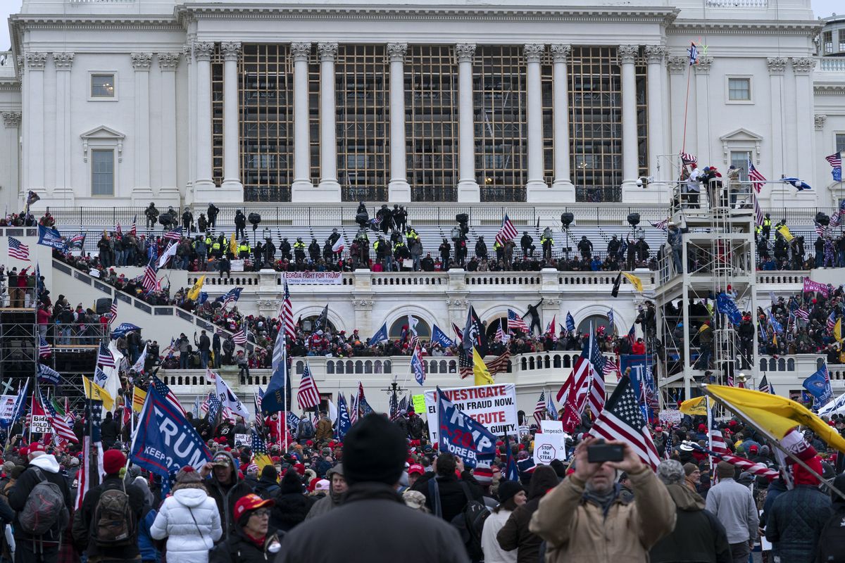 In this Jan. 6, 2021 photo, violent insurrectionists loyal to President Donald Trump storm the U.S. Capitol in Washington.  (Jose Luis Magana)