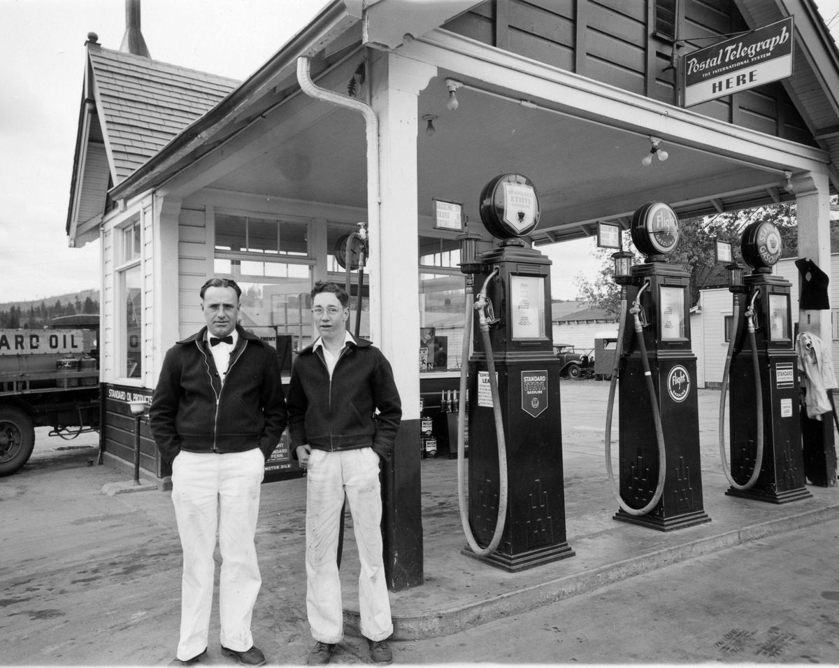 1934 or 1935: Owner Harold Dockendorf, left, and employee Charles “Sparky” Burton stand in front of Doc’s Snappy Service, a gas station at 9208 E. Sprague Ave.