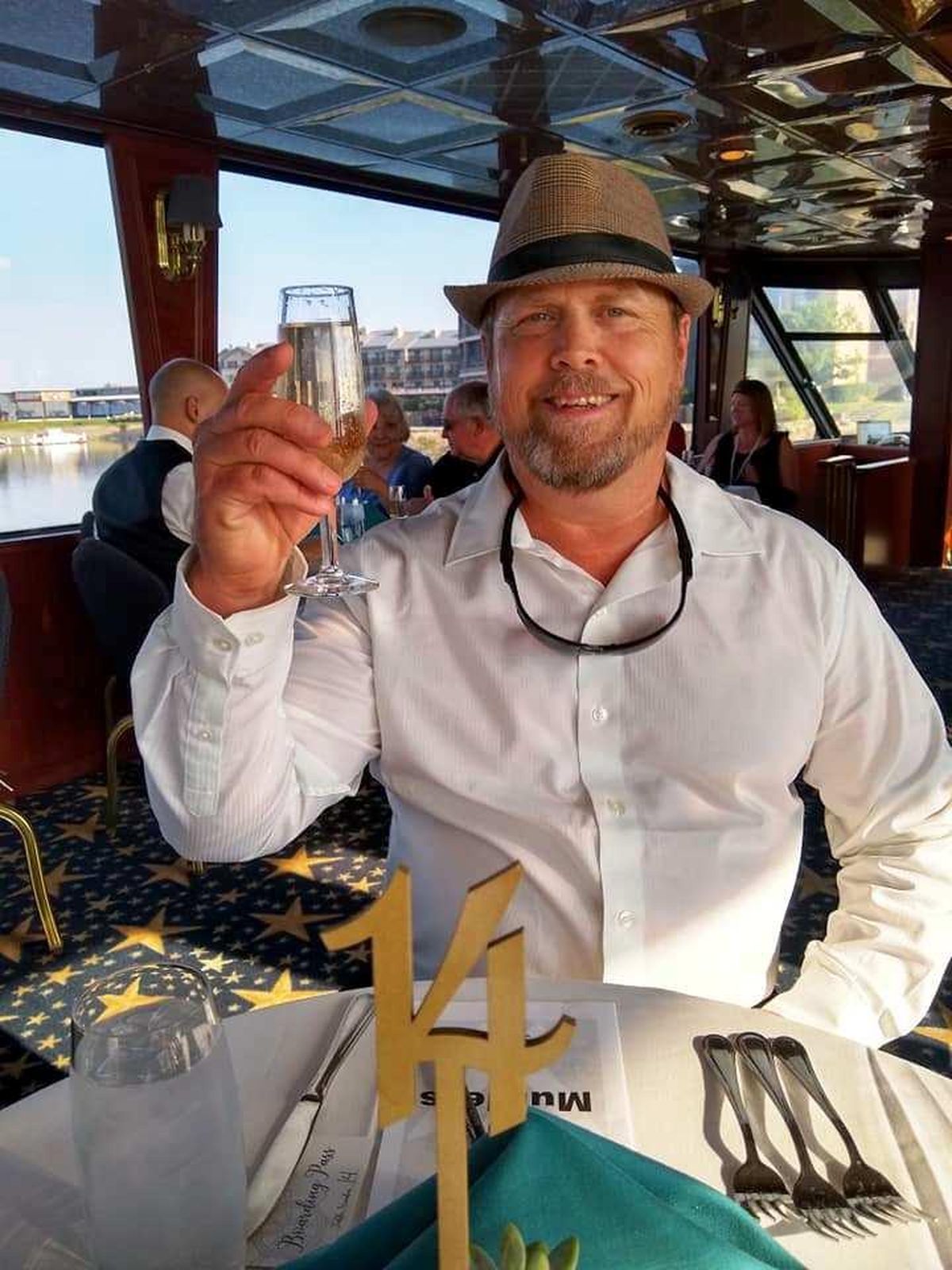 Derek Hval toasts champagne before mayhem erupts in a murder mystery cruise on the Columbia River. (Cindy Hval / The Spokesman-Review)