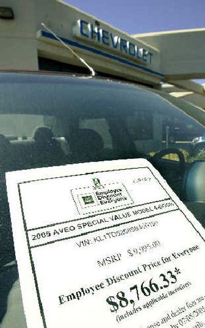 
A sticker for employee discount prices is on the windshield of a car at the Riverton Chevrolet dealership in Sandy, Utah. 
 (Associated Press / The Spokesman-Review)