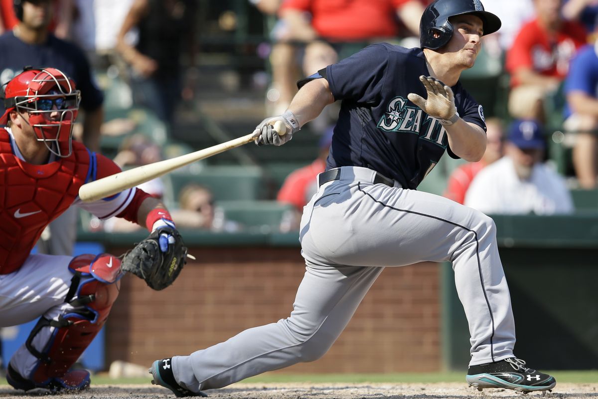 The Mariners’ Kyle Seager follows through on a tiebreaking RBI double against Rangers closer Joe Nathan in the ninth inning. (Associated Press)