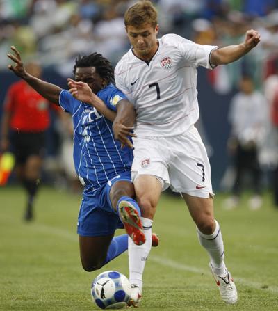 Honduras’ Walter Martinez, left, strips the ball from the United States’ Robbie Rogers during the first half. (Associated Press / The Spokesman-Review)