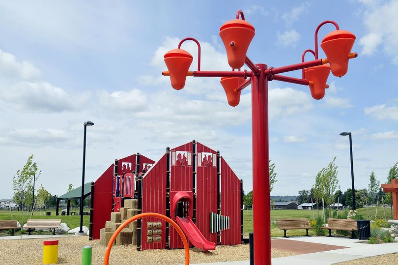 A farm- themed play structure and a splash pad grace the new Greenacres Park. (Jesse Tinsley)