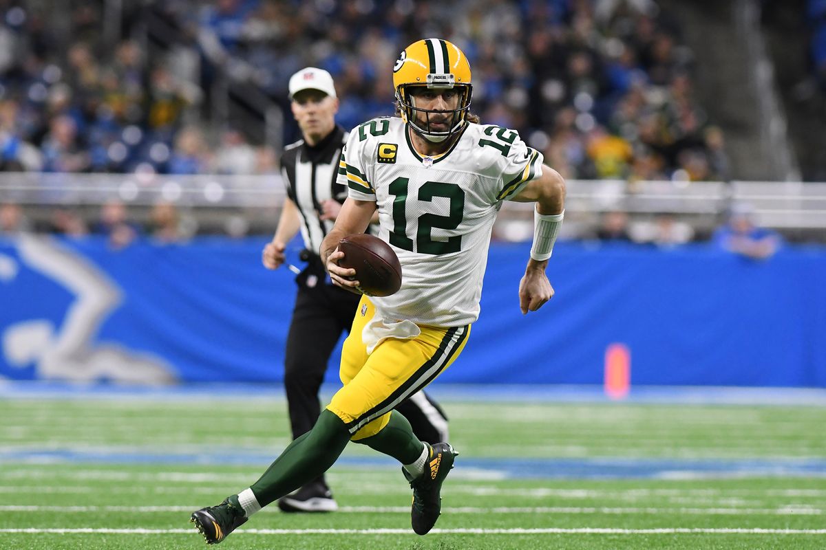 Green Bay Packers quarterback Aaron Rodgers scrambles during the first half of an NFL football game against the Detroit Lions, Sunday, Jan. 9, 2022, in Detroit.  (Lon Horwedel)