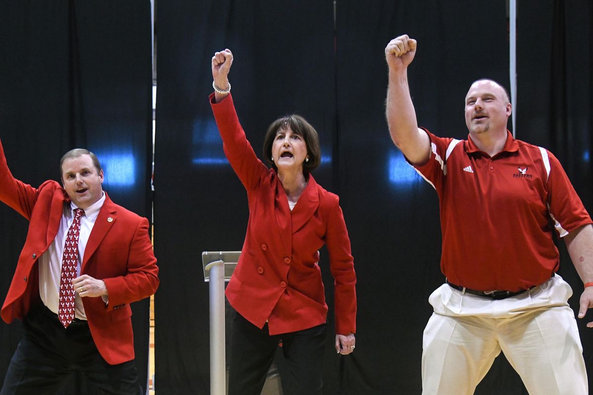 Eastern Washington Director of Athletics Lynn Hickey, center, and EWU head football coach Aaron Best, right, react after Hickey’s introduction ceremony on April 25, 2018, at Reese Court in Cheney.  (Dan Pelle / The Spokesman-Review)