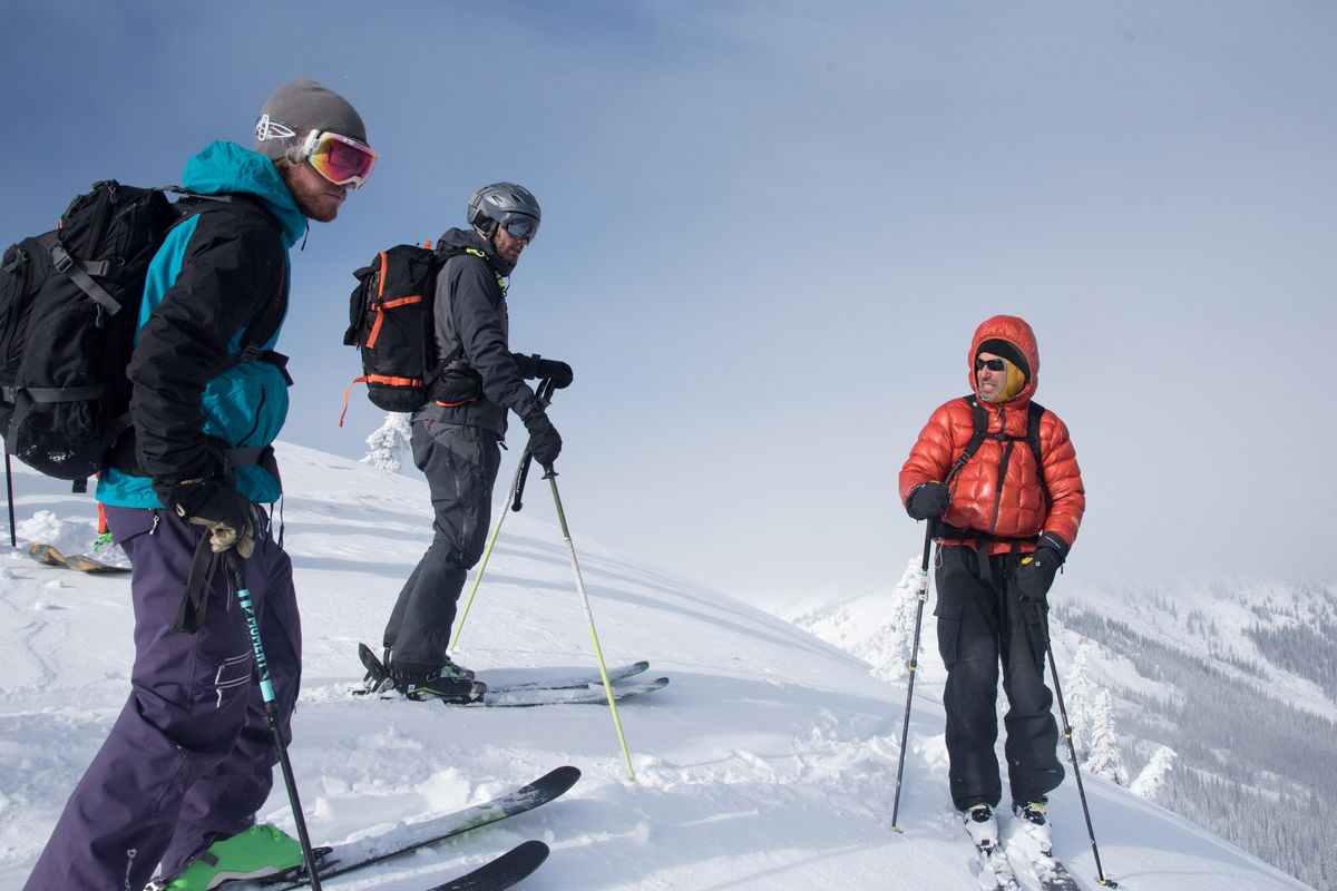 Jack Sutter, left, Eric DeRosa and Keith Robine discuss the upcoming terrain on Monday, Feb. 4, 2019. Robine was leading a eight students through the B.C. backcountry near Kootenay Pass as part of an avalanche training course. (Eli Francovich / The Spokesman-Review)