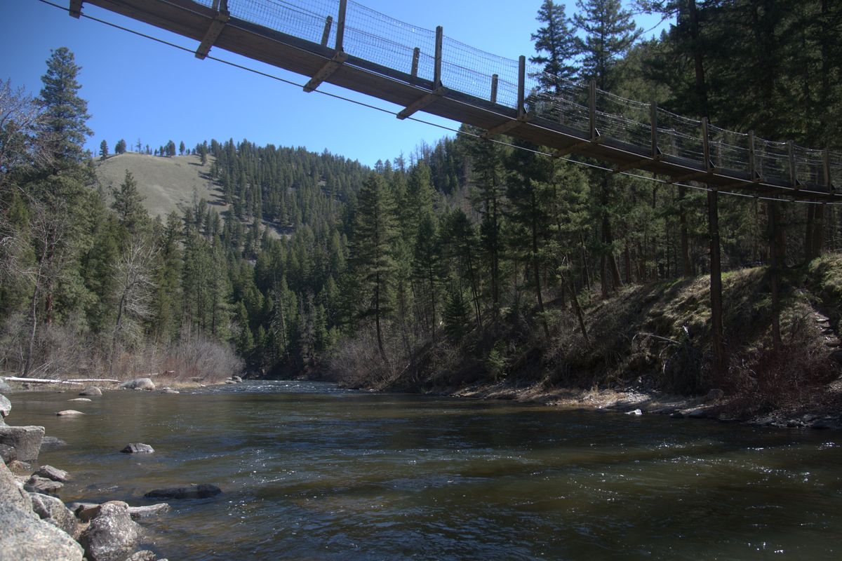 The Welcome Creek Trail begins at this swinging bridge over Rock Creek, near Clinton, Montana.  (Michael Wright/The Spokesman-Review )