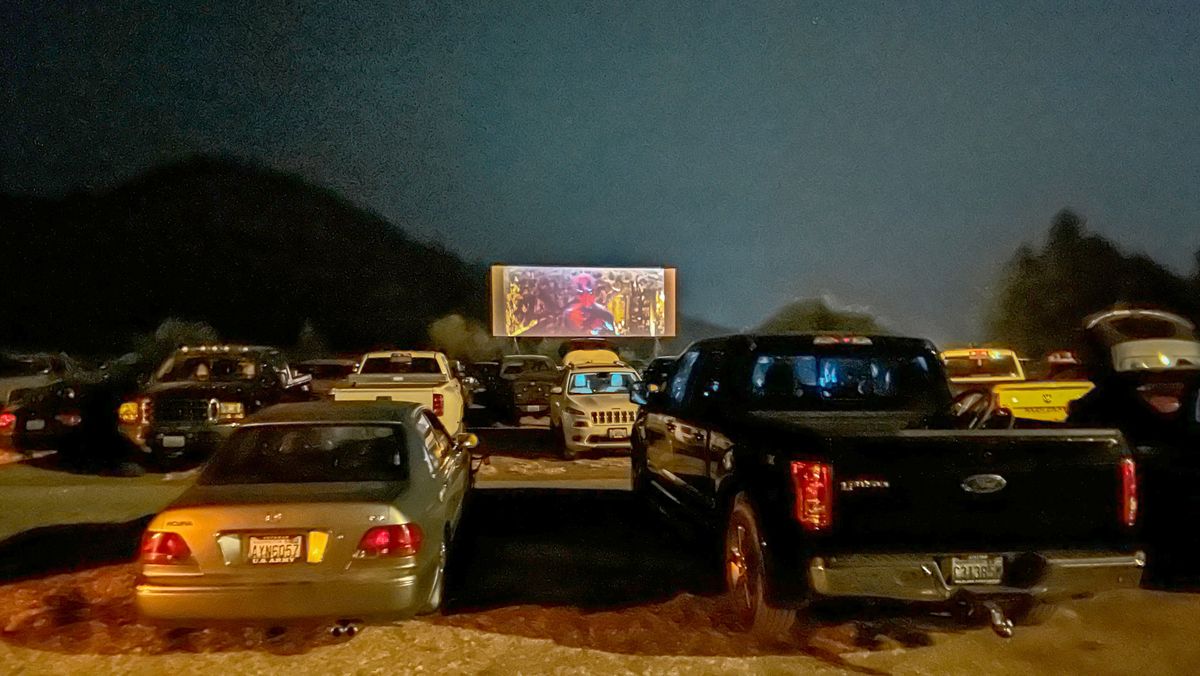 Cars and trucks pile in to catch a showing of “Deadpool and Wolverine” at the Auto-Vue Drive-In Theatre on July 27 in Colville.  (Matthew Callaghan/The Spokesman-Review)