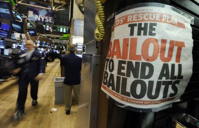 In this Oct. 2 file photo, a newspaper headline is taped to a booth on the New York Stock Exchange floor. Associated Press file photo (Associated Press file photo / The Spokesman-Review)