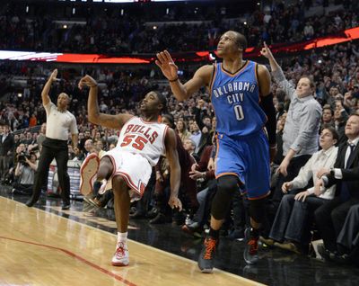 The Bulls’ E'Twaun Moore and Thunder guard Russell Westbrook watch Moore’s game-winning shot. (Associated Press)