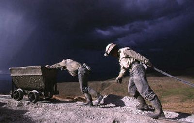 
Miners haul wagons of rocks on Cerro Rico mountain near Potosi, Bolivia. That country's plan to exert greater state control over all of its natural resources has North American mining companies fretting over their future in Bolivia. 
 (FileAssociated Press / The Spokesman-Review)