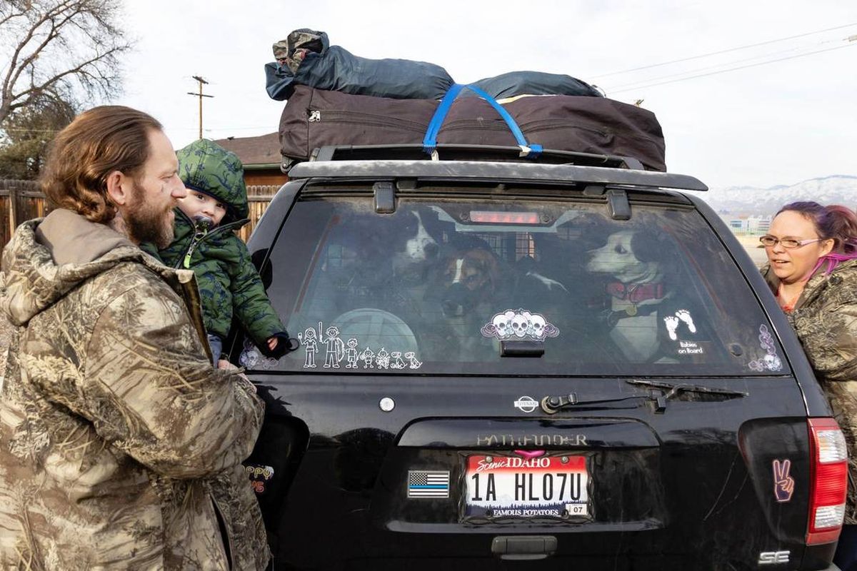 Thomas and Bonnie Lowder are a family of five, plus three pet dogs, who are living in their Nissan Pathfinder in Boise.  (Sarah A. Miller/Idaho Statesman)