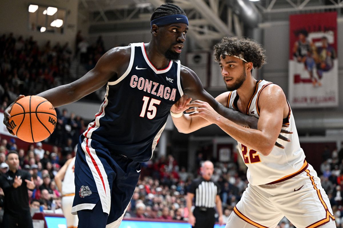 Gonzaga Bulldogs forward Graham Ike (15) drives to the hoop against Santa Clara Broncos forward Allen Graves (22) during the first half of a college basketball game on Saturday, Feb 14, 2026, at the Leavey Center in Santa Clara, Calif.  (Tyler Tjomsland/The Spokesman-Review)