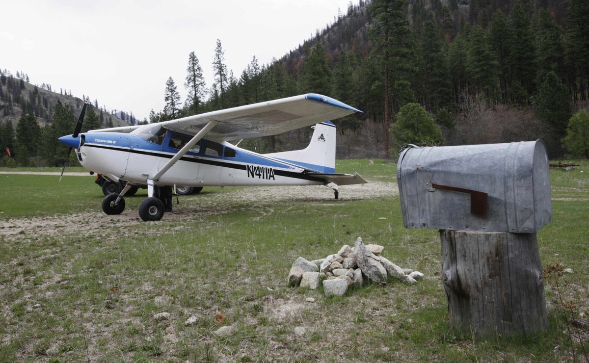 Ray Arnold’s airplane  sits parked near a mailbox at Shepp Ranch on the Salmon River in April. Arnold flies the only backcountry air mail route left in the lower 48 states, delivering mail to nearly two dozen ranches on a stretch of land larger than Indiana.  (File photos Associated Press / The Spokesman-Review)