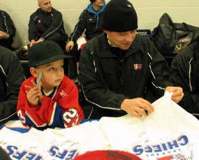 
Local Lethbridge, Alberta, news stations take their turns interviewing Spokane Chiefs overage forward Judd Blackwater, the third Blood Tribe member to play in the Western Hockey League.
 (Jess Brown / The Spokesman-Review)