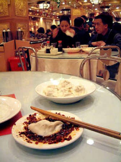 
A plate of pork and chive dumplings are seen at the Oriental Dumpling King, in Harbin, China.
 (File/Associated Press / The Spokesman-Review)