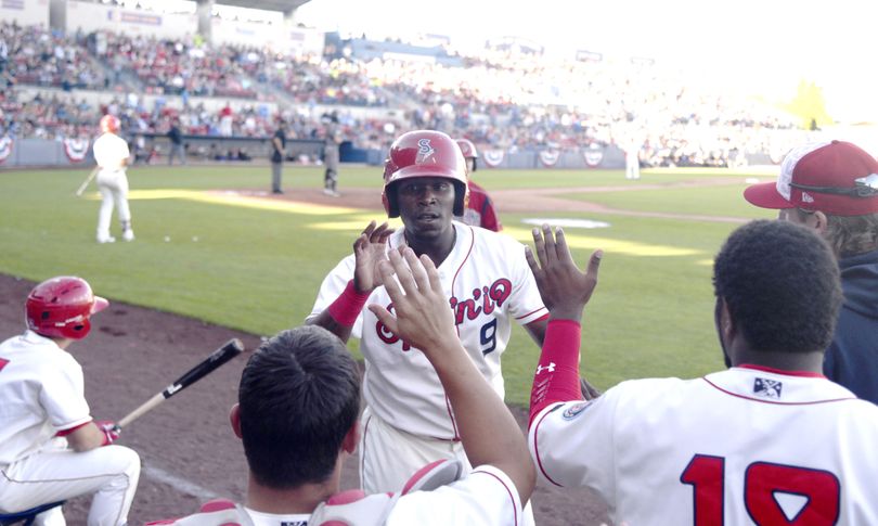 Xavier Turner of the Spokane Indians is congratulated at the dugout for scoring in the third inning against the Boise Hawks on July 4 at Avista Stadium. Turner is one of four NWL All-Stars representing the Spokane Indians. (Jesse Tinsley / The Spokesman-Review)