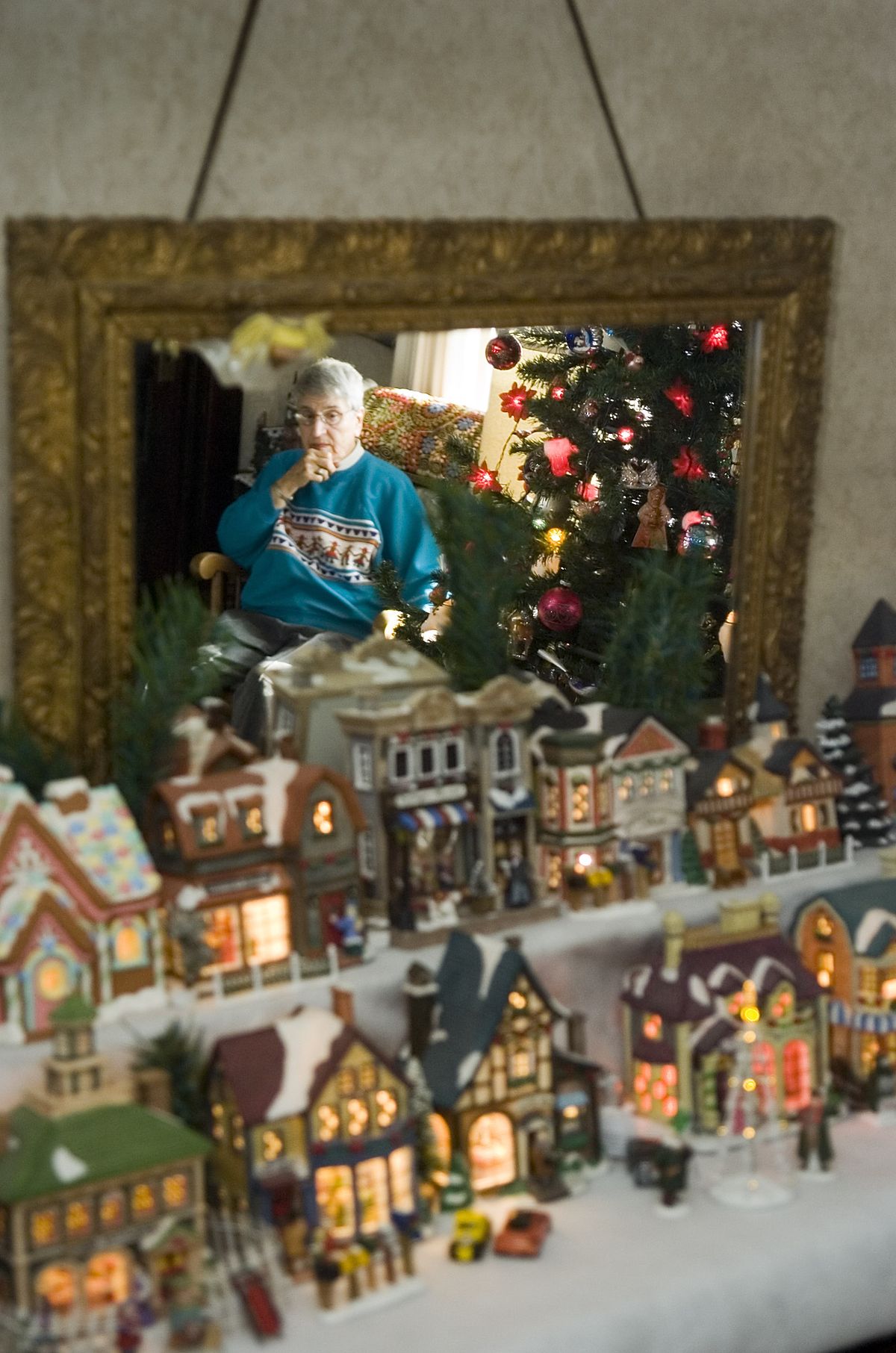 Virginia Danke goes all-out for Christmas and fills her Spokane  home with ornaments and decorations. She is shown near her tree,  admiring the lights and sounds of Christmas.chrisa@spokesman.com (CHRISTOPHER ANDERSON)
