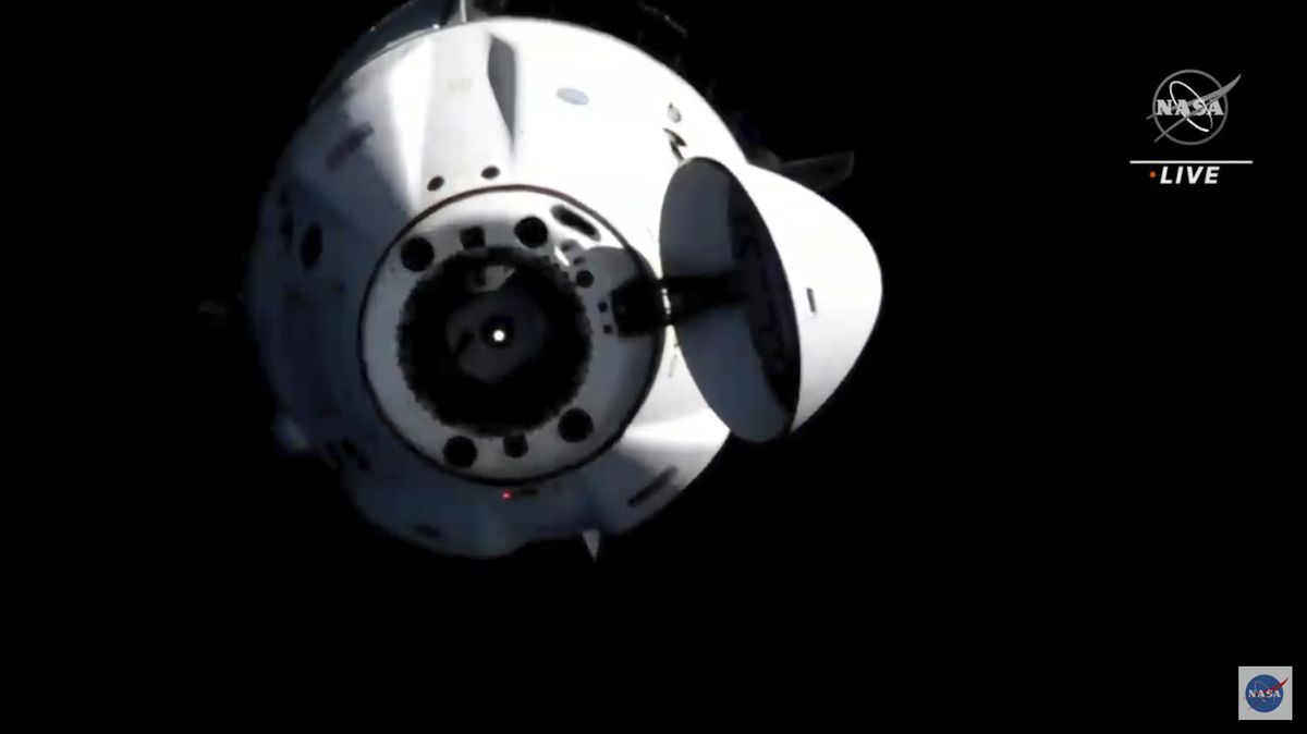 In this image from video provided by NASA, astronauts in the SpaceX Dragon capsule undock from the International Space Station on Monday.  (HOGP)
