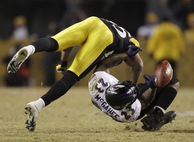 Baltimore’s Willis McGahee fumbles as he is hit by Pittsburgh’s Ryan Clark in the fourth quarter. (Associated Press / The Spokesman-Review)