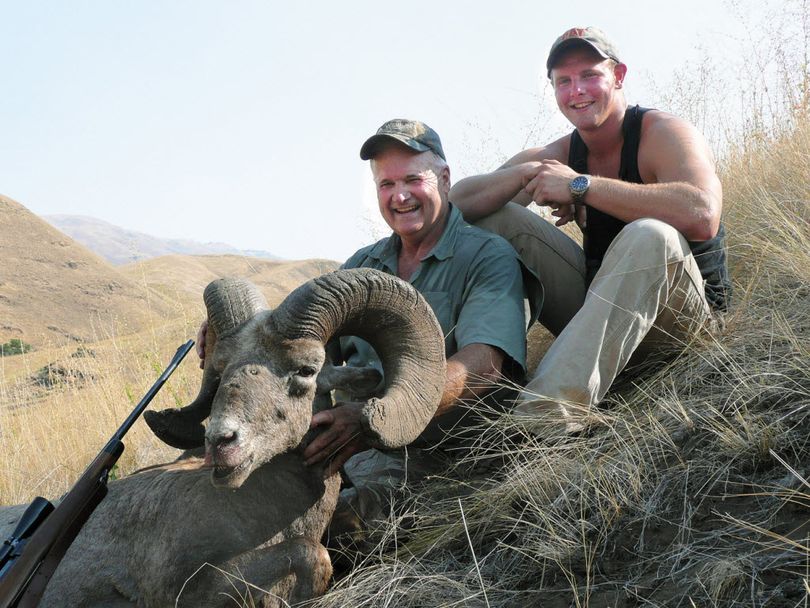 Mandy Miles of Lewiston and his son, Spencer Miles, pose with the bighorn ram the elder Miles took in a Unit 11 hunt south of Lewiston in September 2011. (Mandy Miles)