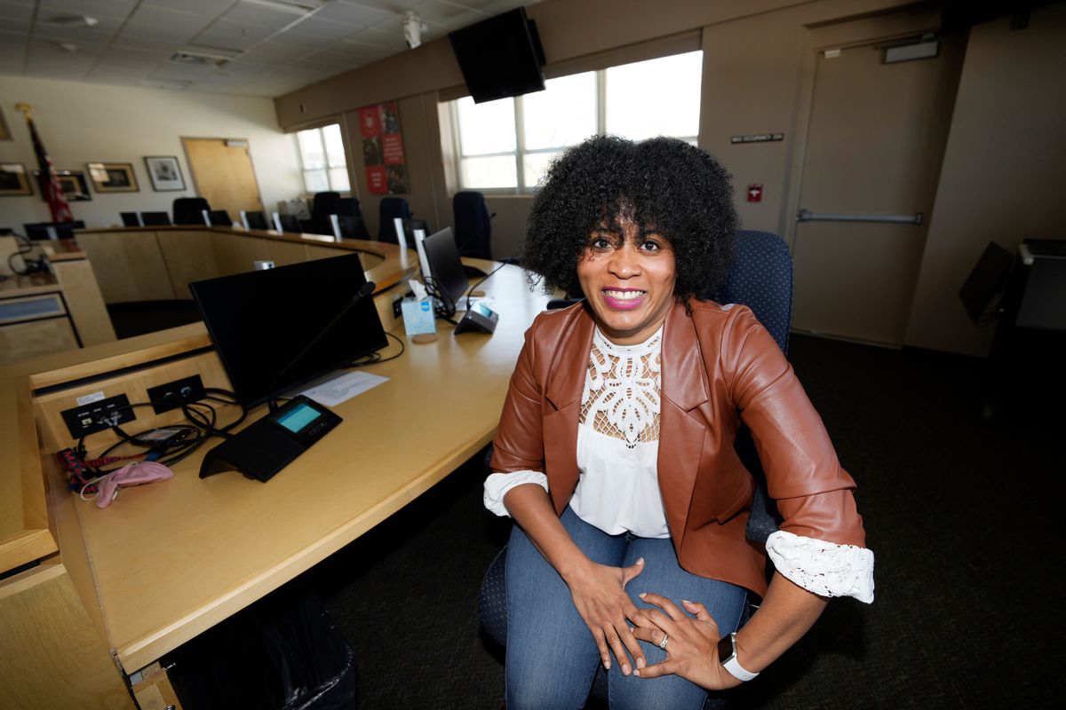 Alexis Knox-Miller, equity director for the Colorado Springs, Colo., school system, poses on Friday, Feb. 4, 2022 in the boardroom in the district