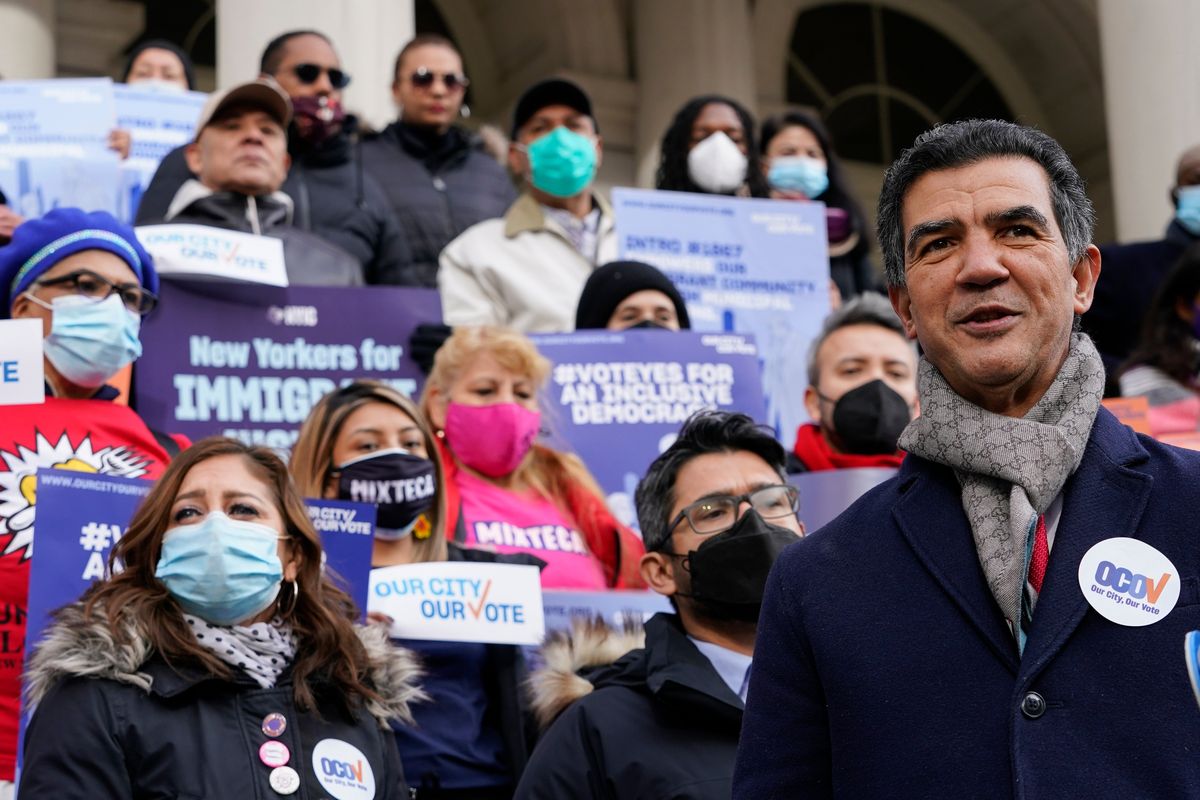 Former New York City Council Member Ydanis Rodriguez speaks during a rally on the steps of City Hall ahead of a City Council vote Dec. 9 to allow lawful permanent residents to cast votes in elections to pick the mayor and other officeholders.  (Mary Altaffer)