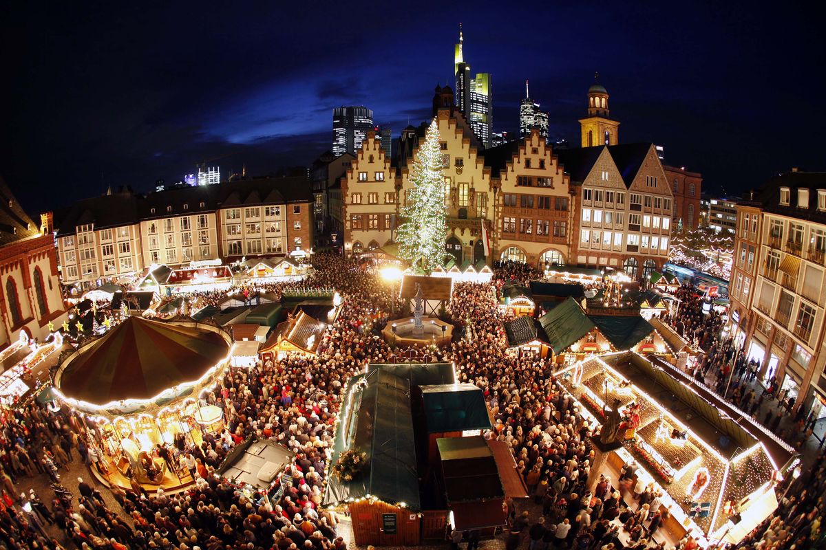 Left: A merry-go- round is the centerpiece attraction at one of Germany’s larger Christmas markets in Frankfurt.