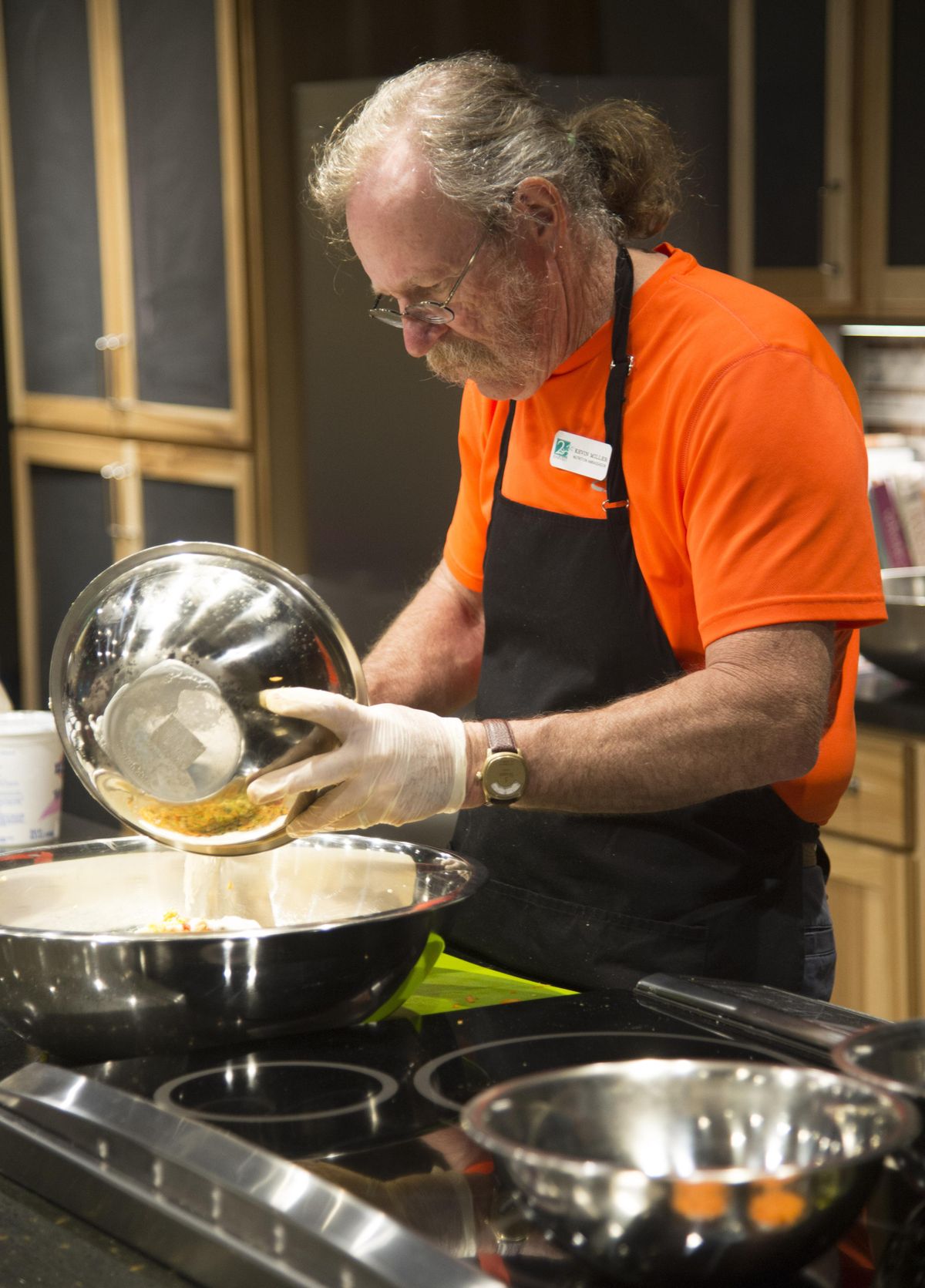 Kevin Miller, a nutrition ambassador with Second Harvest, demonstrates how to make pasta split pea salad in the new community kitchen April, 27. (Colin Mulvany / The Spokesman-Review)