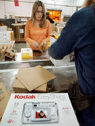 
Employees package Kodak digital cameras in Rochester, N.Y., on Tuesday.
 (Associated Press / The Spokesman-Review)