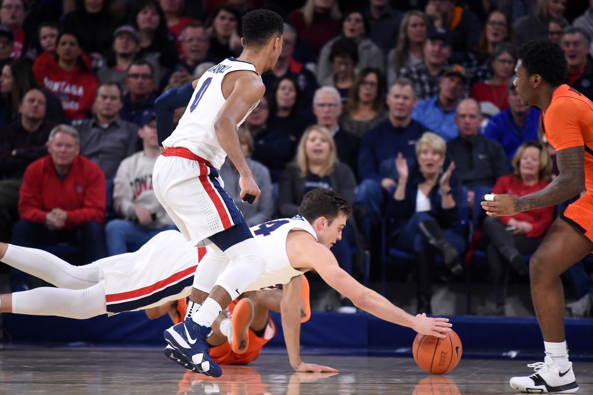 Gonzaga forward Corey Kispert (24) dives for a loose ball during the first half of a college basketball game, Thurs., Jan. 10, 2019, at the McCarthey Athletic Center. (Colin Mulvany / The Spokesman-Review)