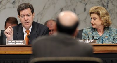 Joint Economic Committee ranking member Sen. Sam Brownback, R-Kan., left, asks a question of Federal Reserve Chairman Ben Bernanke, center, as Committee Chairwoman Rep. Carolyn Maloney, D-N.Y., listens  during a hearing on Capitol Hill in Washington on Tuesday. (Associated Press / The Spokesman-Review)