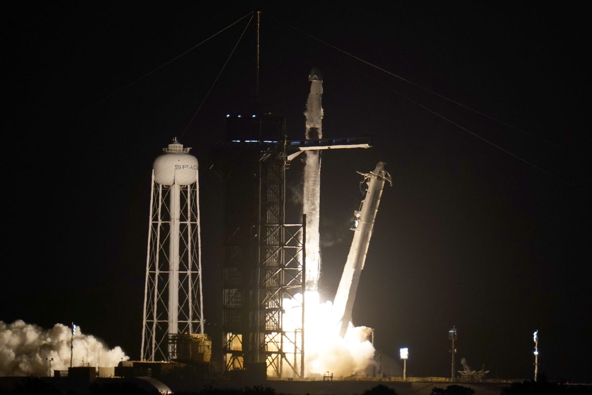 A SpaceX Falcon 9 rocket with the Crew Dragon space capsule lifts off from pad 39A at the Kennedy Space Center in Cape Canaveral, Fla., Friday, April 23, 2021.  (John Raoux)