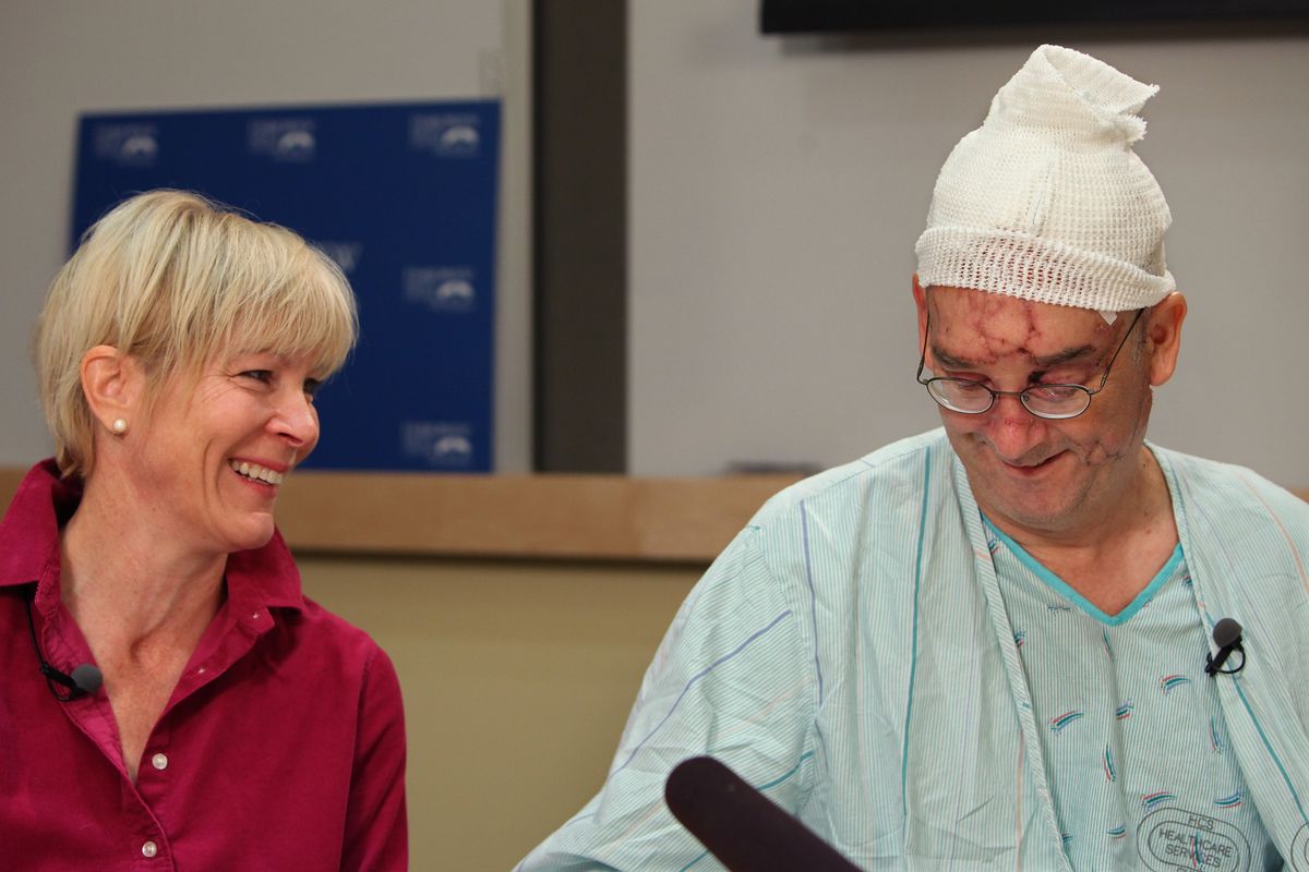 Bellevue City Council member John Chelminiak and his wife, Lynn Semlerm share a laugh, releasing some tension after the harrowing description John made of being mauled by a black bear last month during a news conference at Harborview Hospital in Seattle on Wednesday, Oct. 6, 2010. (Steve Ringman / The Seattle Times)