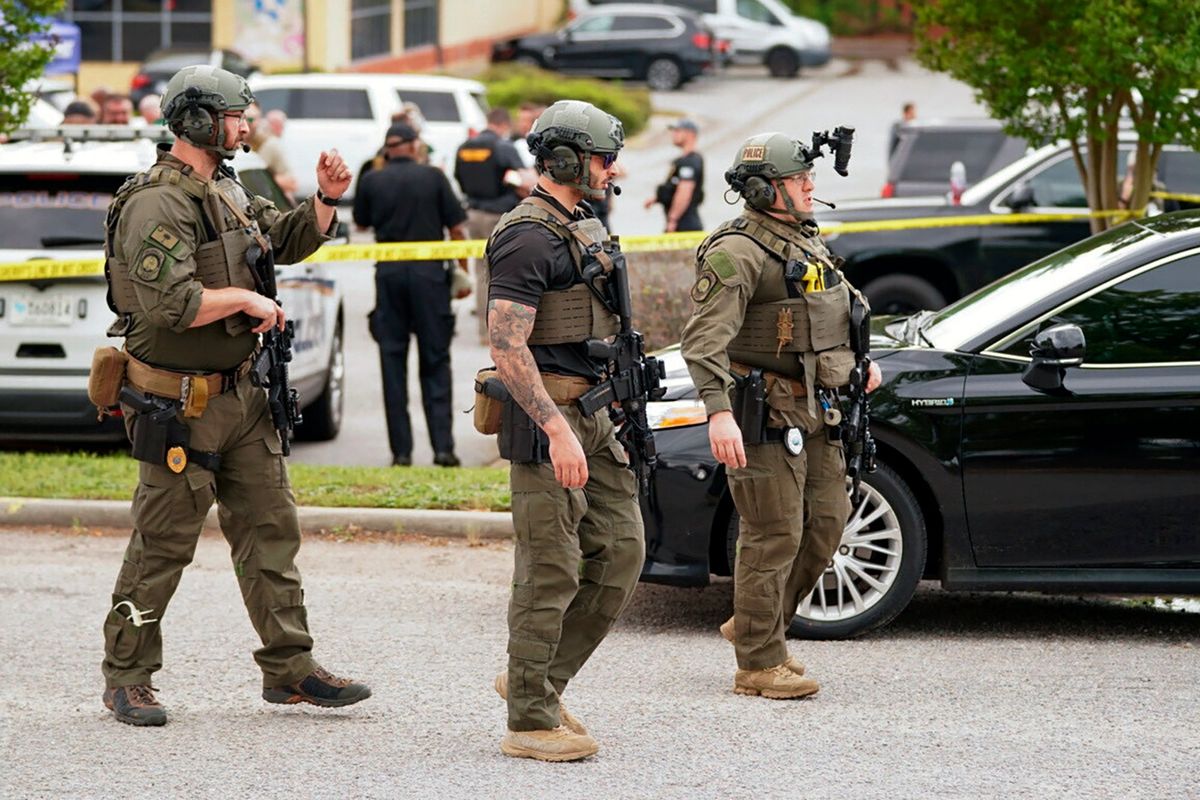 Authorities stage outside Columbiana Centre mall in Columbia, S.C., following a shooting, Saturday, April 16, 2022.  (Sean Rayford)