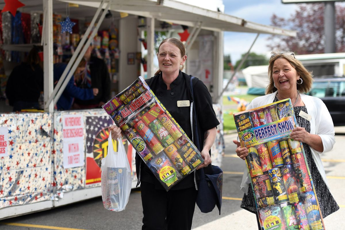 “They’re going to love it,” Connie Lussier, right, activities director for Bestland Senior Living Community said while buying fireworks with Bestland kitchen manager Sara Stepro in Coeur d’Alene on Tuesday  (Kathy Plonka/The Spokesman-Revie)