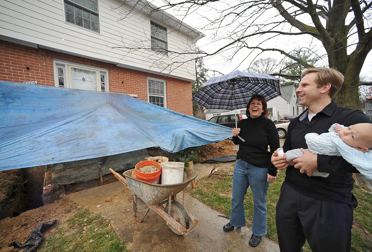 Laura Landon and Joseph Dennis, with baby Jasper, decided that now is the time for a $45,000 facelift to the entrance of their five-bedroom colonial in Arlington, Va. While millions of Americans are losing their jobs, a small segment is spending freely. Washington Post photos (Washington Post photos / The Spokesman-Review)
