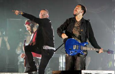 
Grammy Award winner Linkin Park performs last month. Warner Music Group Corp., one of the world's largest recording companies, said Tuesday that its fiscal third-quarter loss widened as more people bought digital music, rather than CDs. Associated Press
 (Associated Press / The Spokesman-Review)