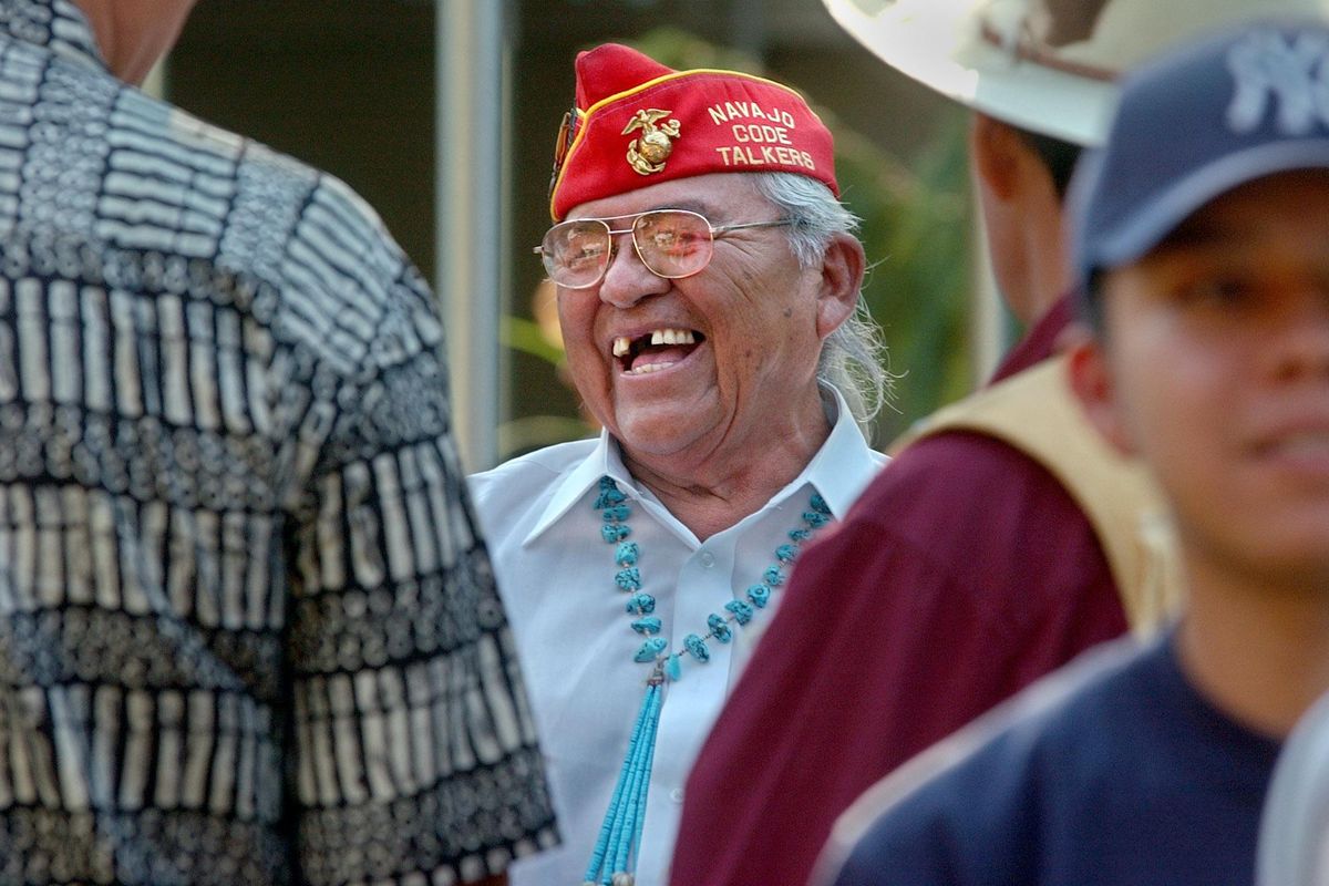 Teddy Draper Jr., laughing with friends and wellwishers at a reception in Post Falls Thursday evening, was a Navajo code talker during WWII. Draper, who fought on Iwo Jima, died Thursday at age 96 in the small city of Prescott, Arizona. (Jesse Tinsley / The Spokesman-Review)