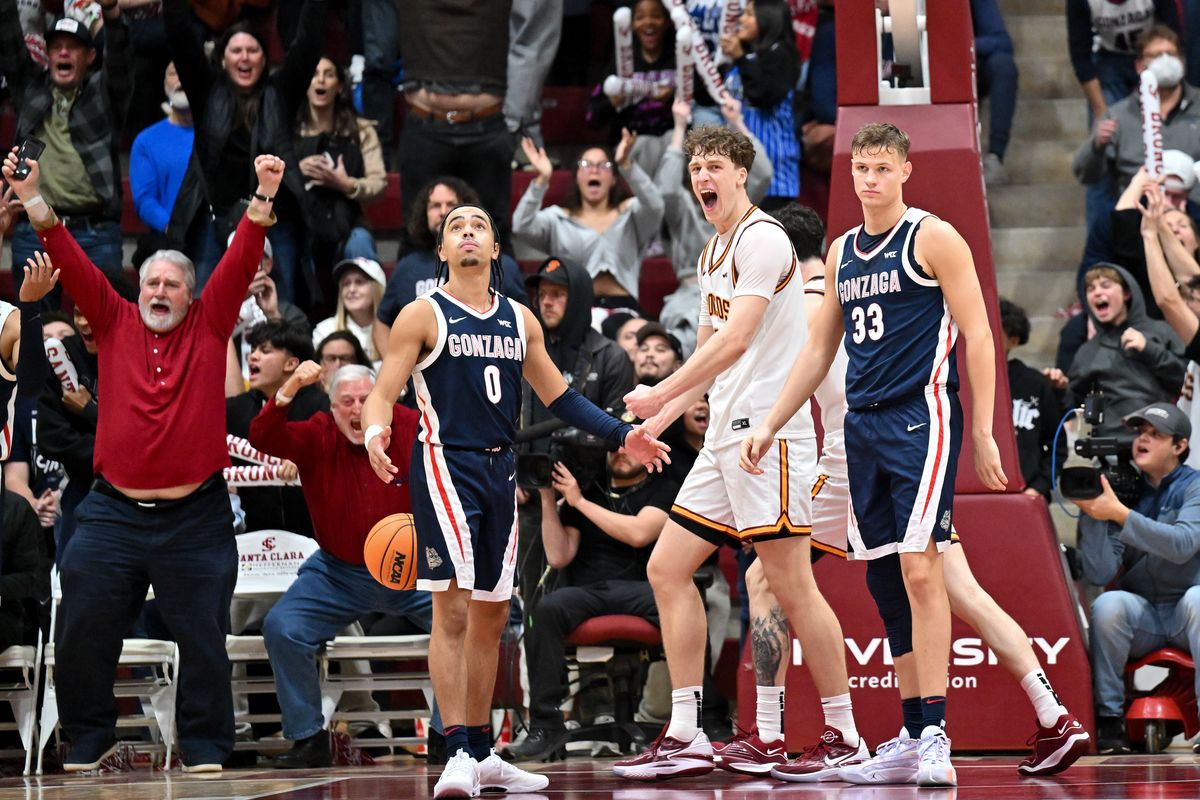 Gonzaga Bulldogs guard Ryan Nembhard (0) and forward Ben Gregg (33) react after as Santa Clara Broncos center Christoph Tilly (13) celebrates after Santa Clara scored late to take the lead during the second half of a college basketball game on Thursday, Jan. 11, 2024, at the Leavey Center in Santa Clara, Calif. Gonzaga lost the game 77-76.  (Tyler Tjomsland/The Spokesman-Review)