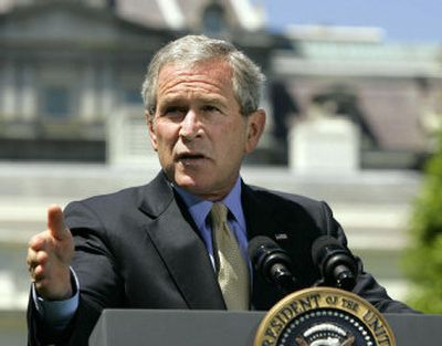 
President Bush addresses member of the news media Friday in the Rose Garden of the White House.
 (Associated Press / The Spokesman-Review)