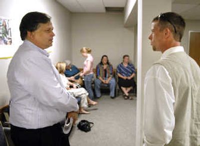 
 Spokane City Councilman Bob Apple, left, chats with Daniel Morgan on Wednesday outside Spokane County Juvenile Court.
 (Dan Pelle / The Spokesman-Review)