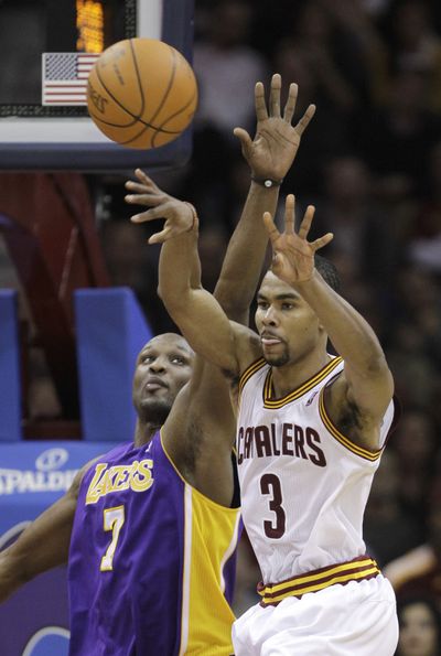 Cleveland’s Ramon Sessions (right) had 32 points off the bench. (Associated Press)