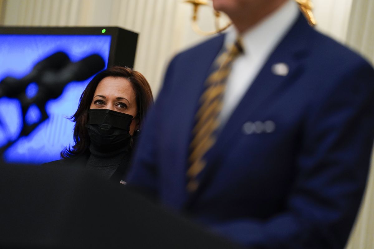 In this Jan. 22, 2021 photo, Vice President Kamala Harris listens as President Joe Biden delivers remarks on the economy in the State Dining Room of the White House in Washington.  (Evan Vucci)