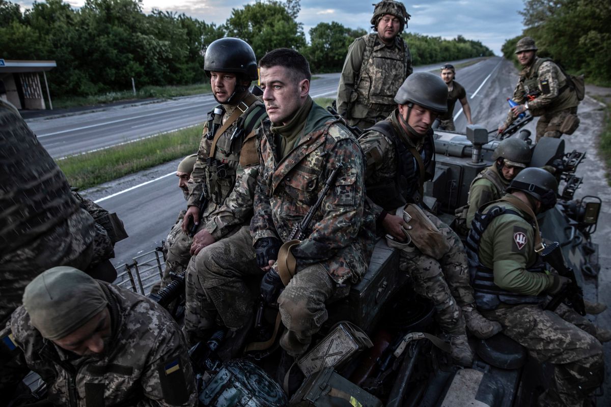 FILE – Ukrainian soldiers from the 95th Air Assault Brigade board an armored vehicle as they head toward the frontline near the city of Kramatorsk in eastern Ukraine on May 25, 2022. The gaps in information on the state of Ukraine’s military forces and the government’s strategy in the eastern Donbas region have created blind spots for the United States.  (Finbarr O