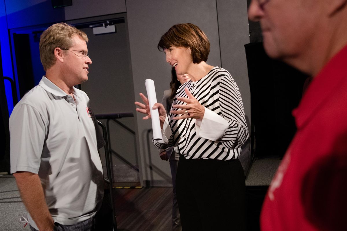Cathy McMorris Rodgers speaks with Paul Schmidt about international trade issues after a town hall on Thursday, Aug. 23, 2018, at the Spokane Convention Center in Spokane, Wash. (Tyler Tjomsland / The Spokesman-Review)
