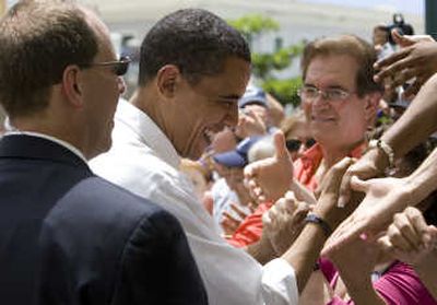 
Democratic presidential hopeful Sen. Barack Obama, D-Ill., shakes hands with crowd members during a campaign stop Saturday in Puerto Rico. Associated Press
 (Associated Press / The Spokesman-Review)