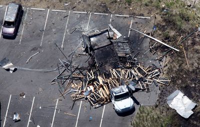 An aerial view shows the devastation at the site of a fireworks truck explosion in Ocracoke, N.C., in which four people were killed while unloading the truck.  (Associated Press / The Spokesman-Review)